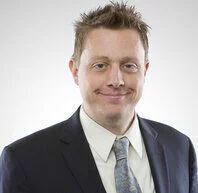  2023/09/Joshua-Farris-Headshot-e1695091037816.jpg 